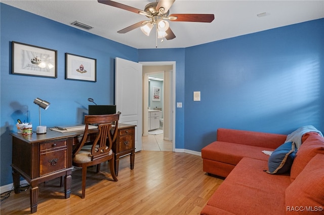 office featuring light hardwood / wood-style flooring and ceiling fan