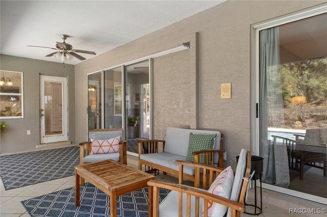 sunroom with ceiling fan