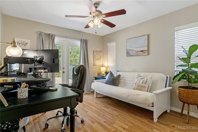 office featuring light hardwood / wood-style floors and ceiling fan