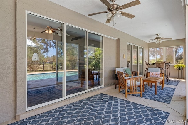 sunroom with ceiling fan