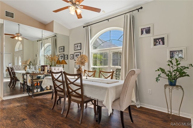 dining area with dark hardwood / wood-style floors, vaulted ceiling, and ceiling fan