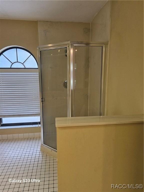 bathroom featuring tile patterned floors and walk in shower