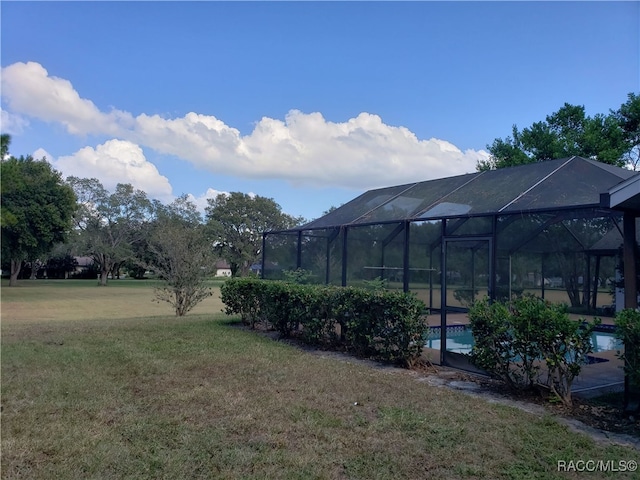 view of yard featuring a lanai