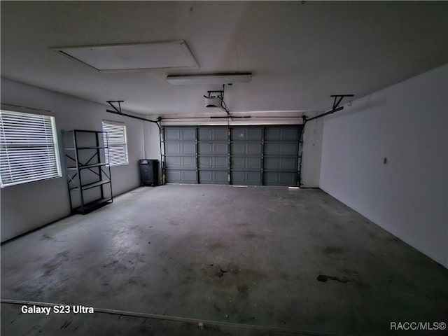 garage featuring a garage door opener