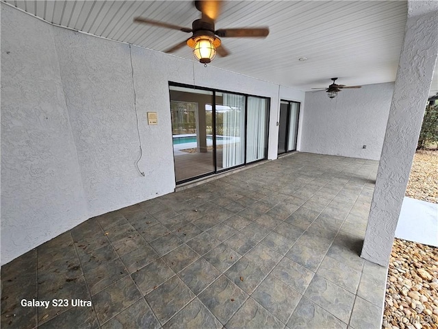 view of patio featuring ceiling fan