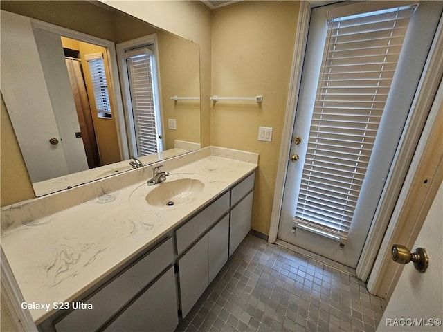 bathroom with vanity and tile patterned floors