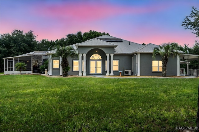 ranch-style house with a yard