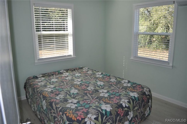 bedroom featuring hardwood / wood-style floors