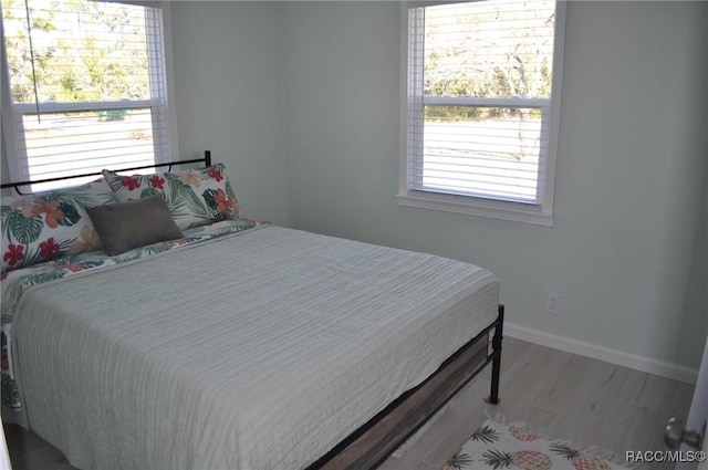 bedroom with hardwood / wood-style flooring