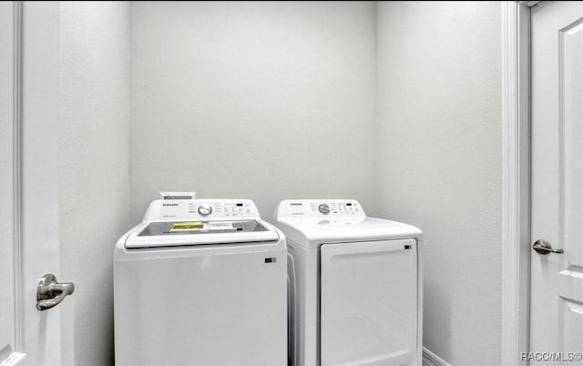 washroom featuring independent washer and dryer