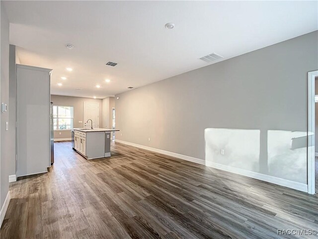 bathroom featuring vanity, toilet, and a shower with door