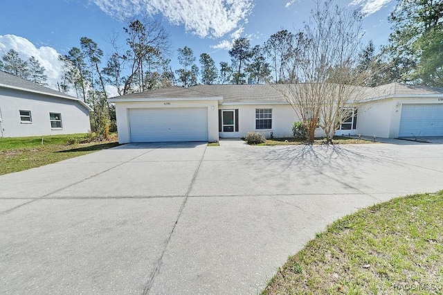 ranch-style house featuring a garage