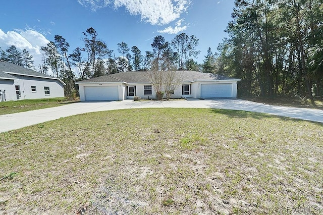 single story home with a garage and a front lawn