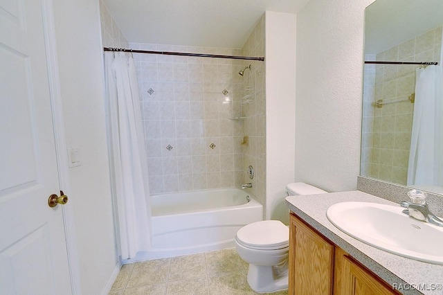 full bathroom featuring vanity, toilet, tile patterned flooring, and shower / bath combo with shower curtain