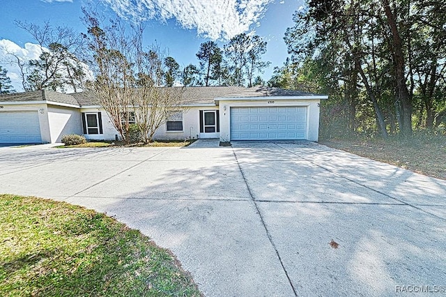 single story home featuring a garage