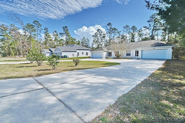 ranch-style home with a garage and a front yard