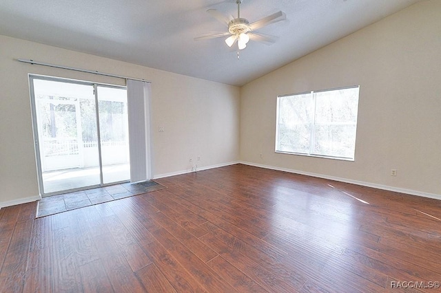 unfurnished room featuring dark wood-type flooring, ceiling fan, and vaulted ceiling