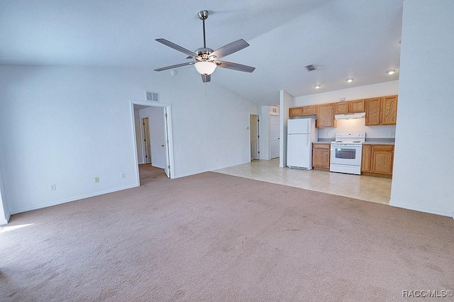 unfurnished living room featuring high vaulted ceiling, light colored carpet, and ceiling fan