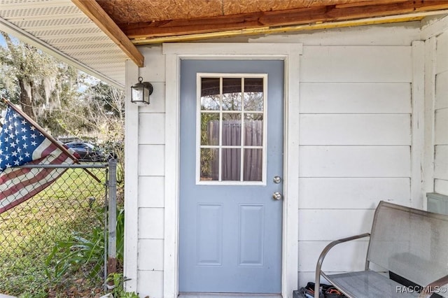 property entrance featuring fence