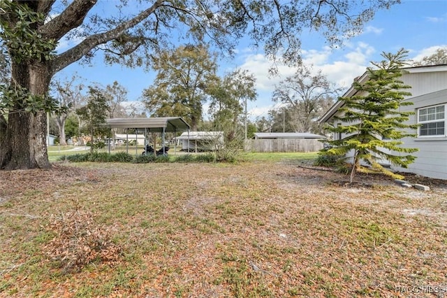 view of yard with a carport