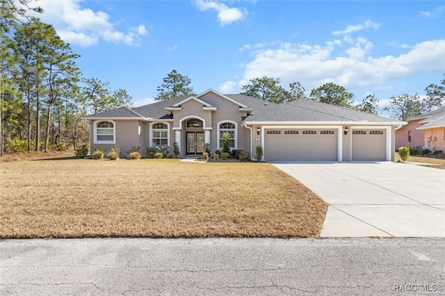 ranch-style house with a garage and a front yard