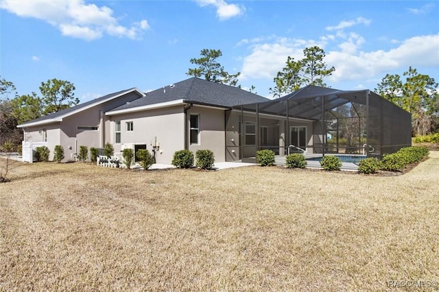 back of house featuring a yard