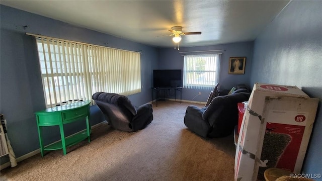 living room with carpet floors and ceiling fan