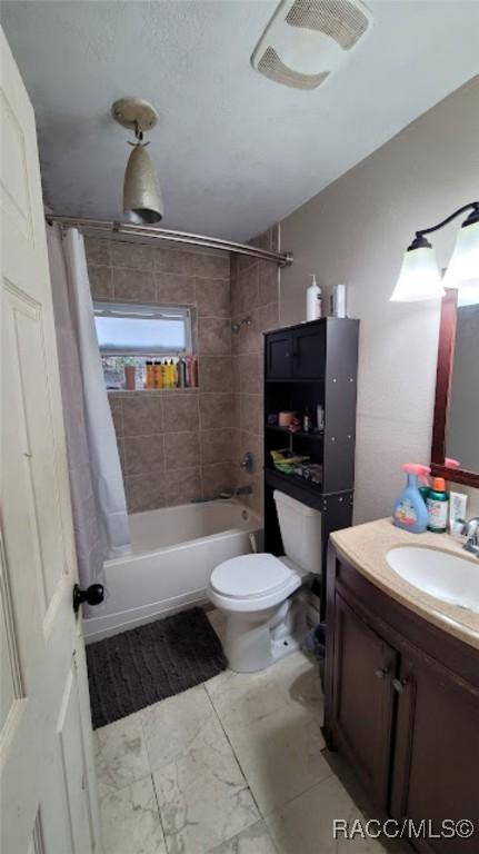 full bathroom with vanity, toilet, and shower / bathtub combination with curtain