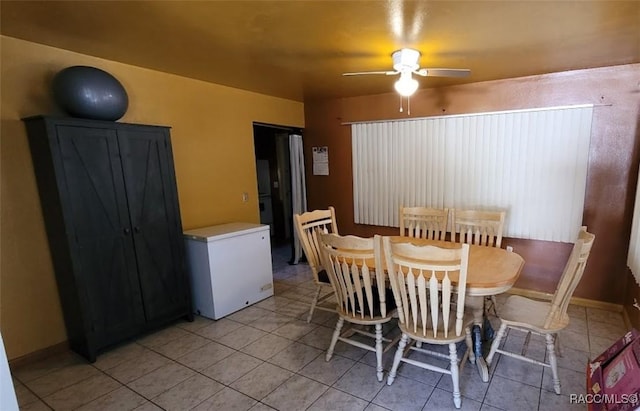 dining room featuring ceiling fan and light tile patterned floors