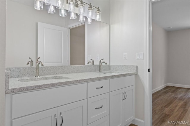 6658 N Bedstrow Blvd, Dunnellon, FL 34434 - full bath with double vanity and wood finished floors