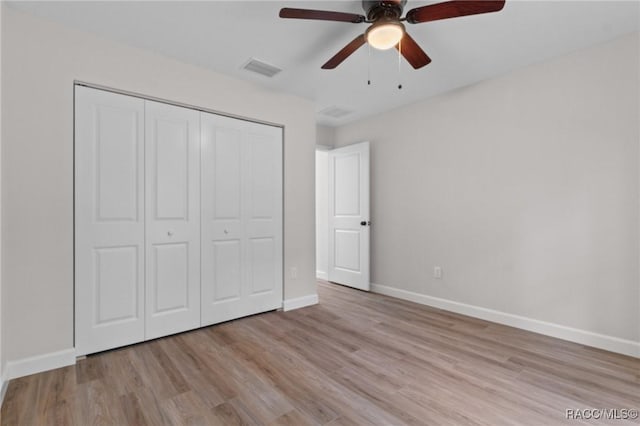 6658 N Bedstrow Blvd, Dunnellon, FL 34434 - unfurnished bedroom featuring wood finished floors, a closet, and a ceiling fan