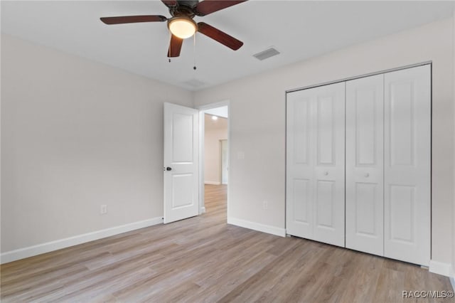 6658 N Bedstrow Blvd, Dunnellon, FL 34434 - unfurnished bedroom featuring light wood-style floors, a closet, and a ceiling fan