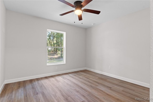 6658 N Bedstrow Blvd, Dunnellon, FL 34434 - spare room with wood finished floors and a ceiling fan
