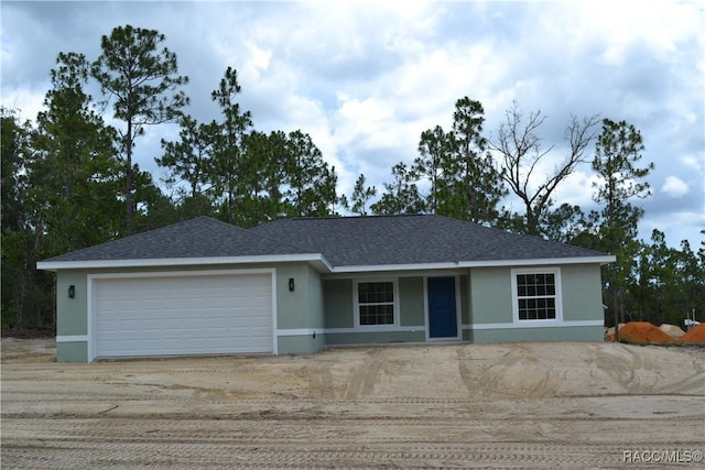 6658 N Bedstrow Blvd, Dunnellon, FL 34434 - ranch-style house with stucco siding, a garage, concrete driveway, and roof with shingles