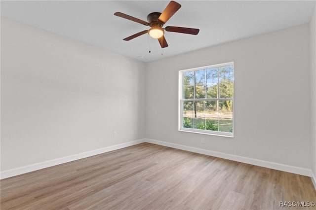 6658 N Bedstrow Blvd, Dunnellon, FL 34434 - unfurnished room featuring wood finished floors and a ceiling fan