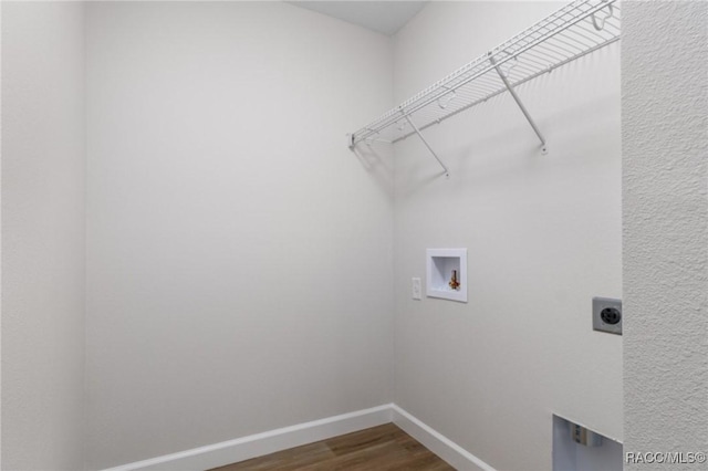 6658 N Bedstrow Blvd, Dunnellon, FL 34434 - laundry room with electric dryer hookup, dark wood-type flooring, and washer hookup