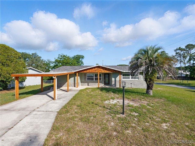 34 S Harrison St, Beverly Hills, FL 34465 - view of front of property with a front yard, concrete driveway, and an attached carport