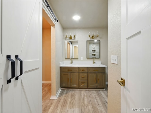 34 S Harrison St, Beverly Hills, FL 34465 - full bathroom featuring wood finished floors, double vanity, and baseboards