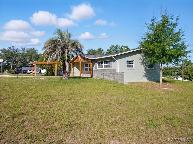 34 S Harrison St, Beverly Hills, FL 34465 - single story home featuring a carport, stucco siding, and a front lawn