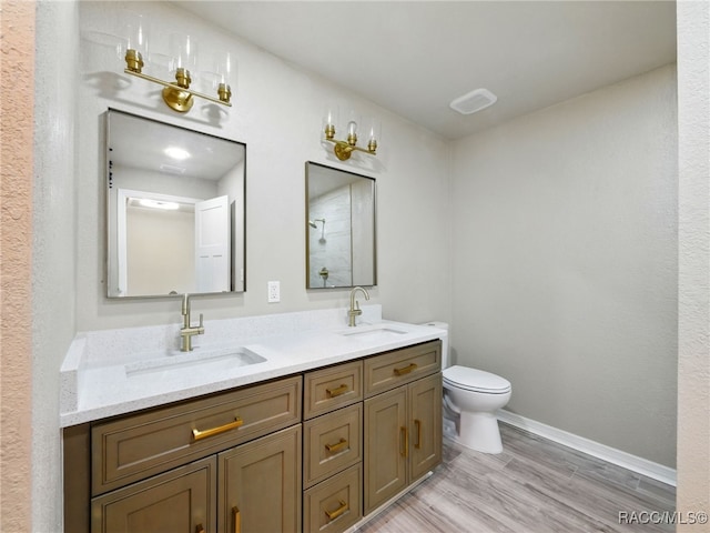 34 S Harrison St, Beverly Hills, FL 34465 - bathroom with toilet, double vanity, wood finished floors, and baseboards