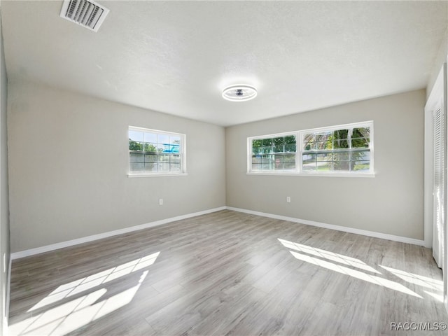 34 S Harrison St, Beverly Hills, FL 34465 - empty room with wood finished floors and baseboards