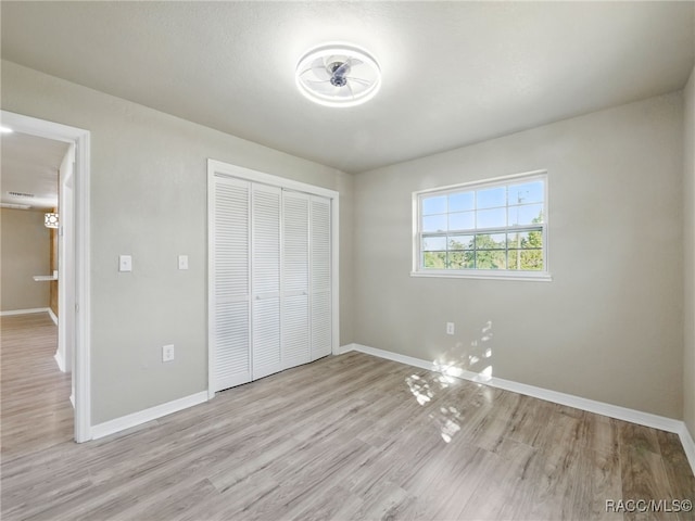 34 S Harrison St, Beverly Hills, FL 34465 - unfurnished bedroom with a closet, baseboards, and light wood-type flooring