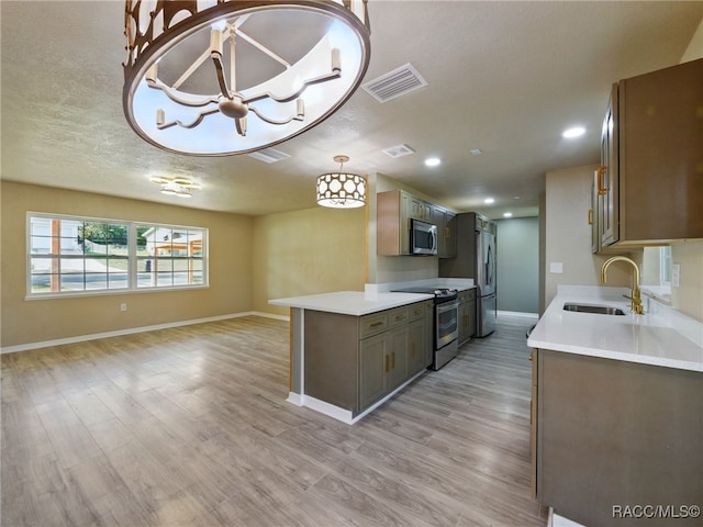 34 S Harrison St, Beverly Hills, FL 34465 - kitchen with appliances with stainless steel finishes, a sink, light countertops, baseboards, and open floor plan