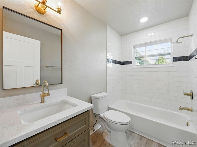 34 S Harrison St, Beverly Hills, FL 34465 - bathroom with toilet, vanity, wood finished floors, and tub / shower combination