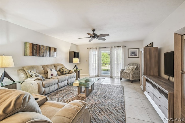 tiled living room featuring ceiling fan