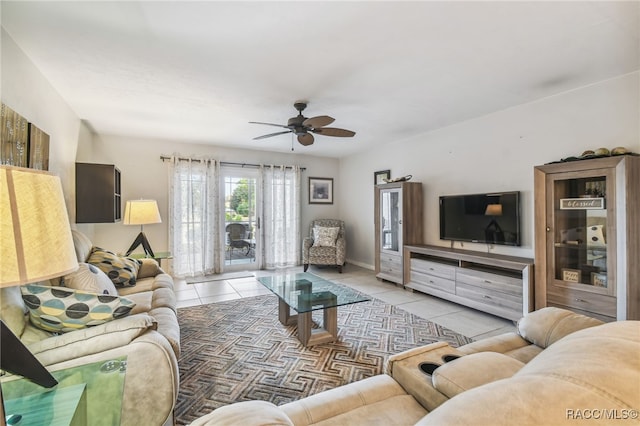 tiled living room featuring ceiling fan