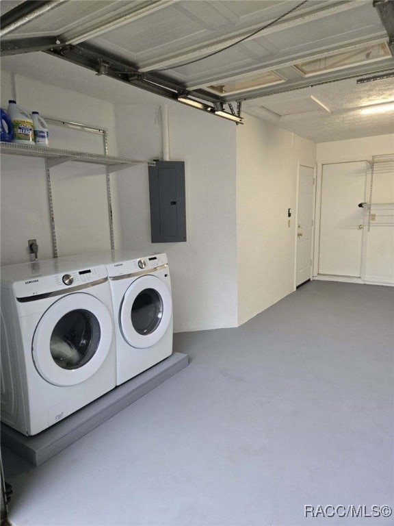 laundry room featuring separate washer and dryer and electric panel