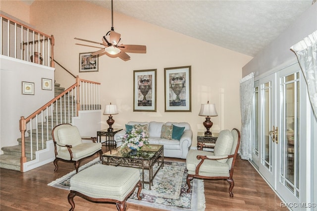 living room featuring ceiling fan, french doors, a textured ceiling, and hardwood / wood-style flooring