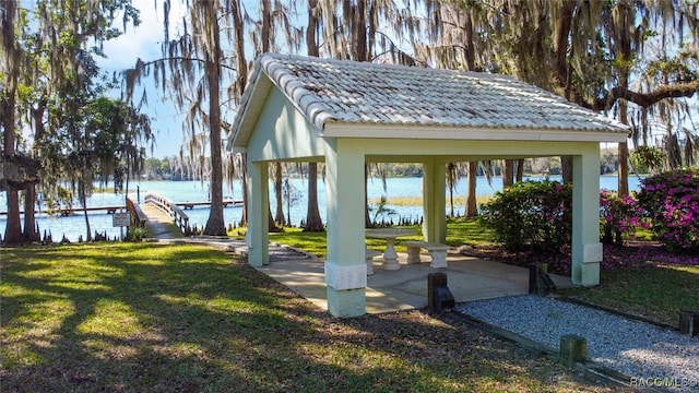 view of yard with a gazebo and a water view