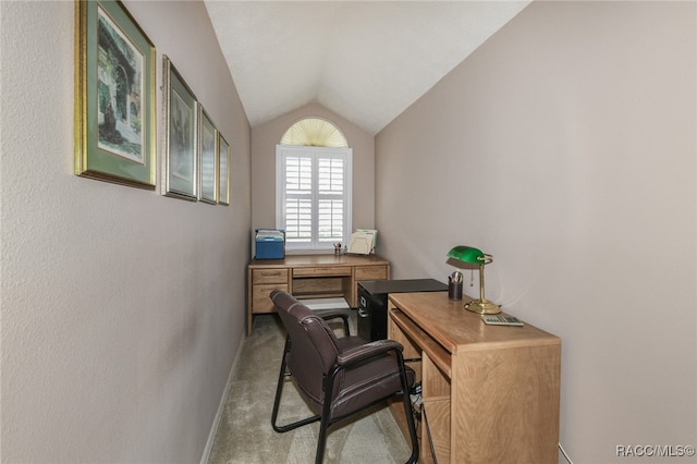 office with light carpet and lofted ceiling